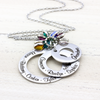 stainless steel 3 layer washer necklace with kids names engraved on each washer and birthstone charms hanging on top.