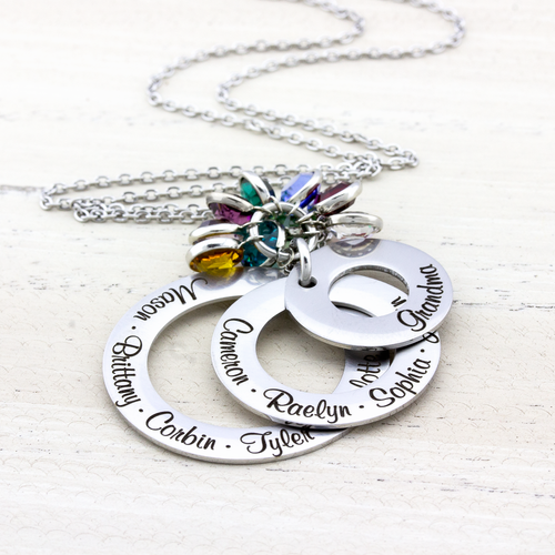 stainless steel 3 layer washer necklace with kids names engraved on each washer and birthstone charms hanging on top.