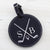 Black round leatherette golf bag tag with 5 golf tees on the back. Can be custom engraved with whatever you like.