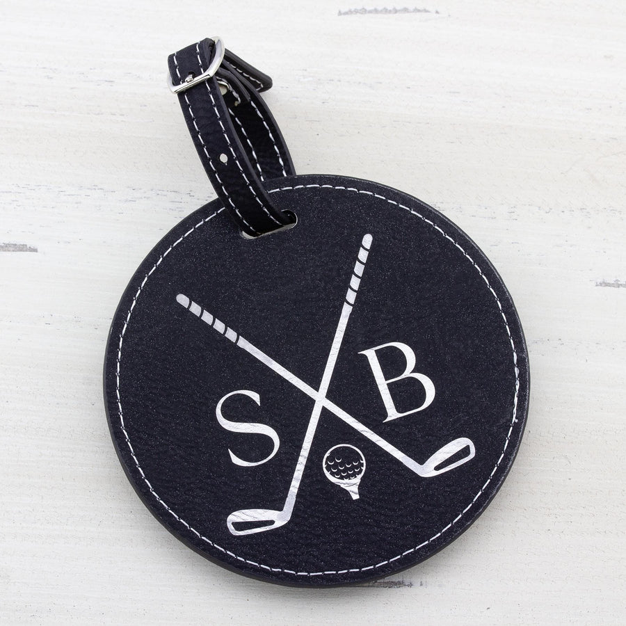 Black round leatherette golf bag tag with 5 golf tees on the back. Can be custom engraved with whatever you like.