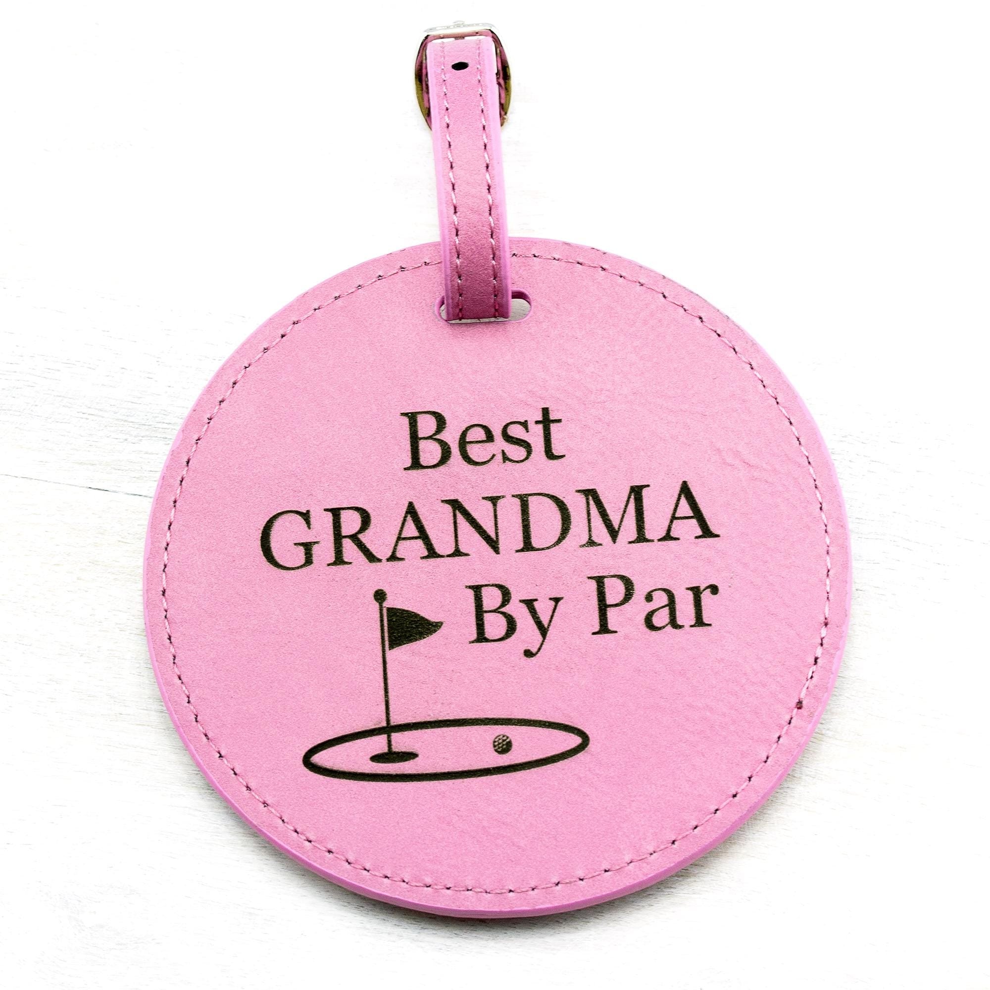 pink round leatherette golf bag tag with 5 golf tees on the back. Can be custom engraved with whatever you like.