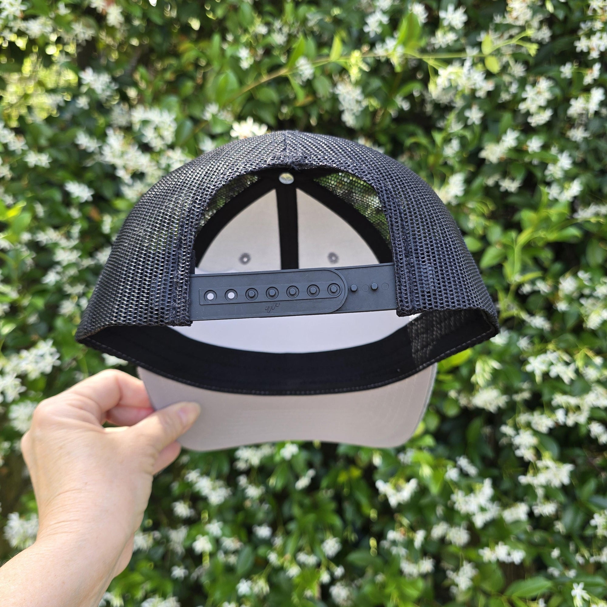 back of heather and black snapback trucker hat
