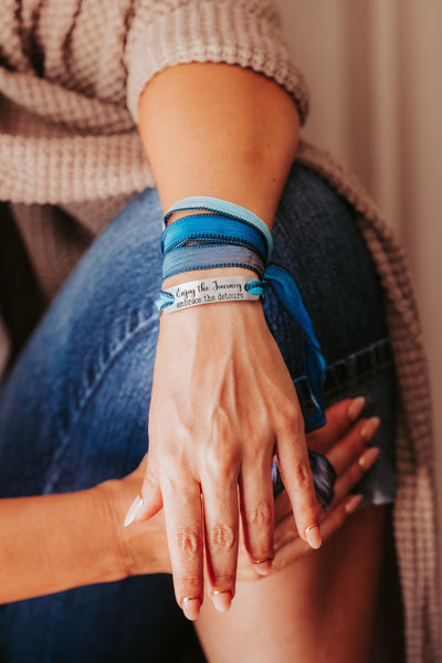 Silk wrap bracelet with stainless steel bar with what you want engraved.