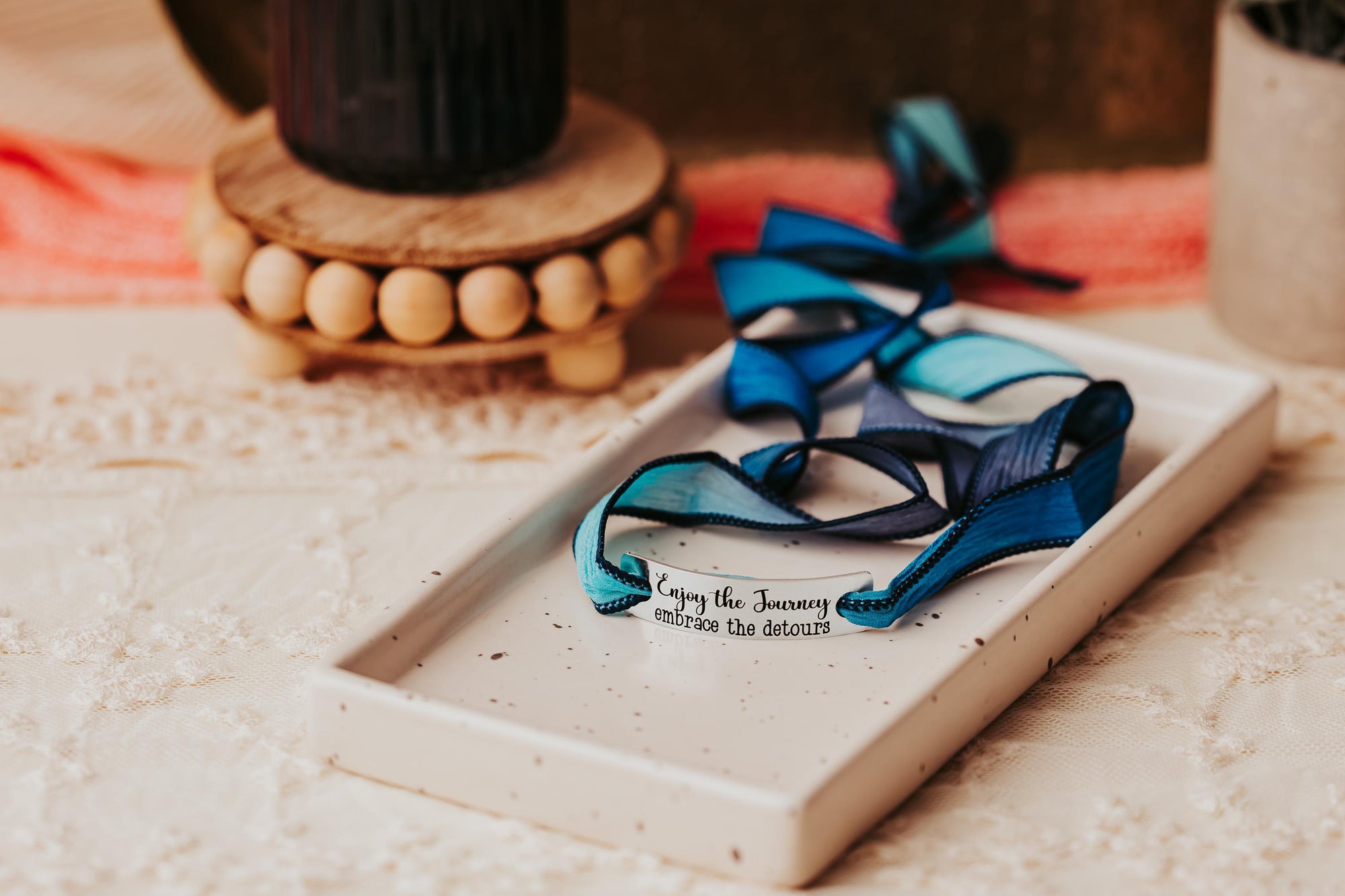 Silk wrap bracelet with stainless steel bar with what you want engraved.