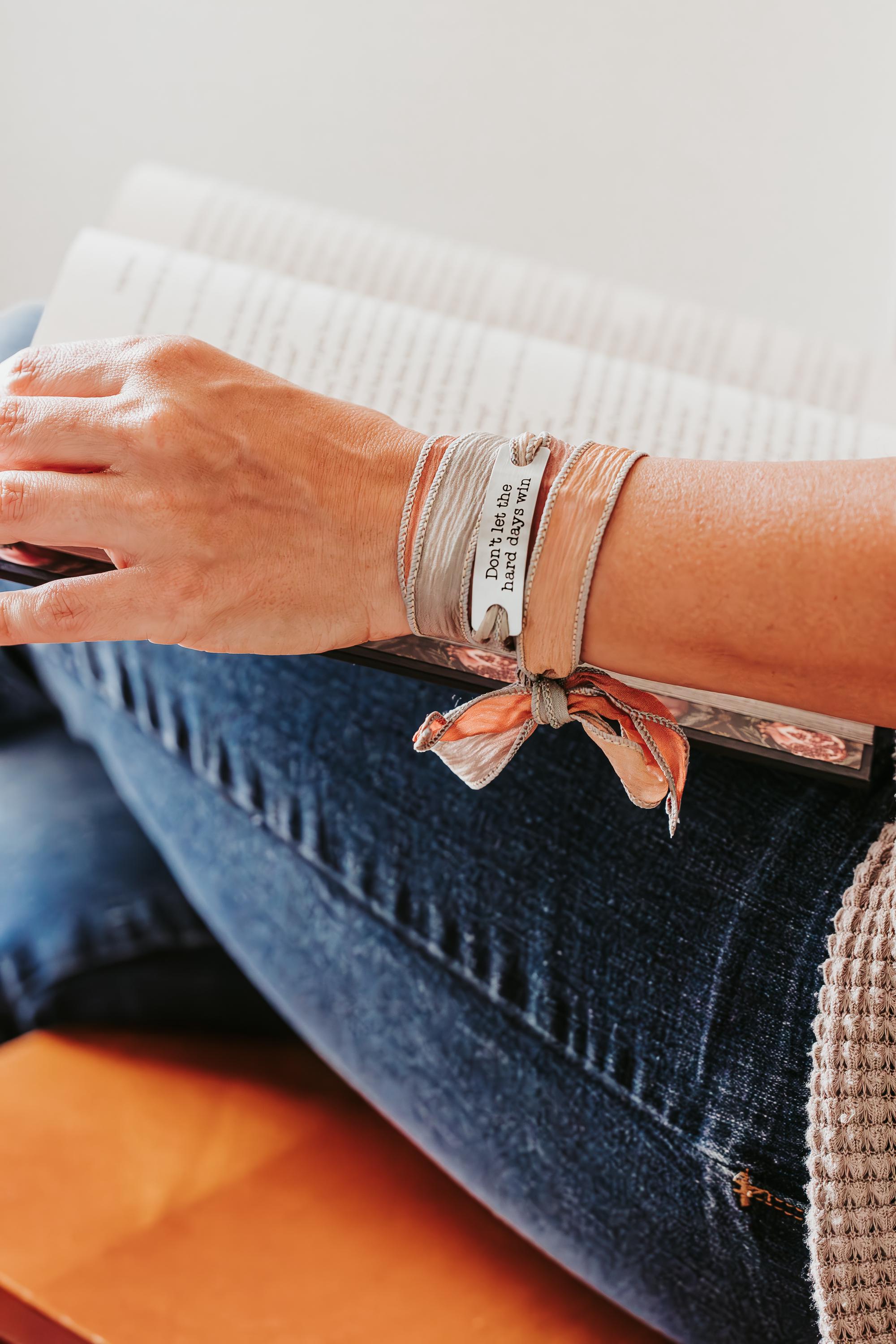 Silk wrap bracelet with stainless steel bar with what you want engraved.