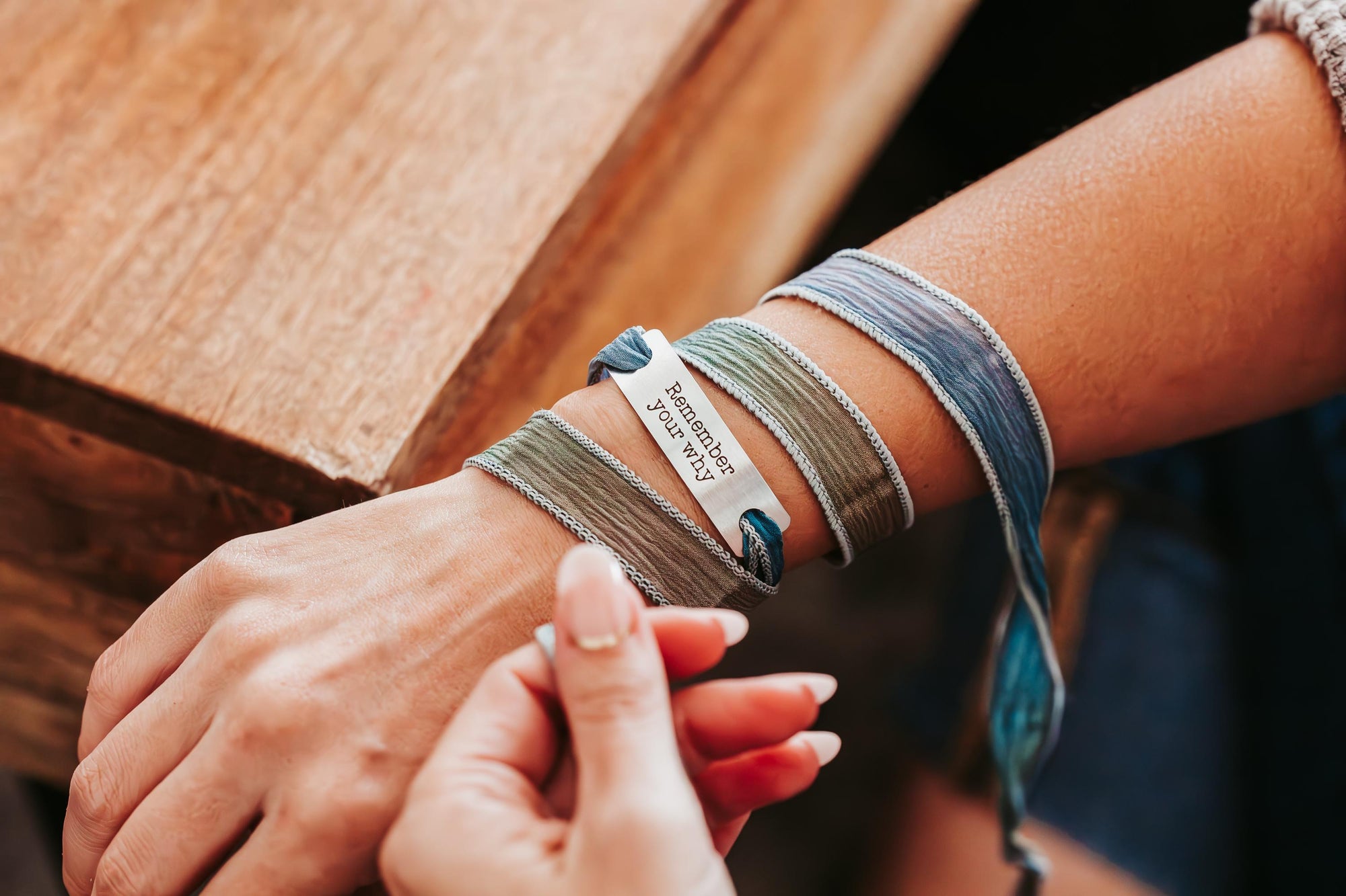 Silk wrap bracelet with stainless steel bar with what you want engraved.