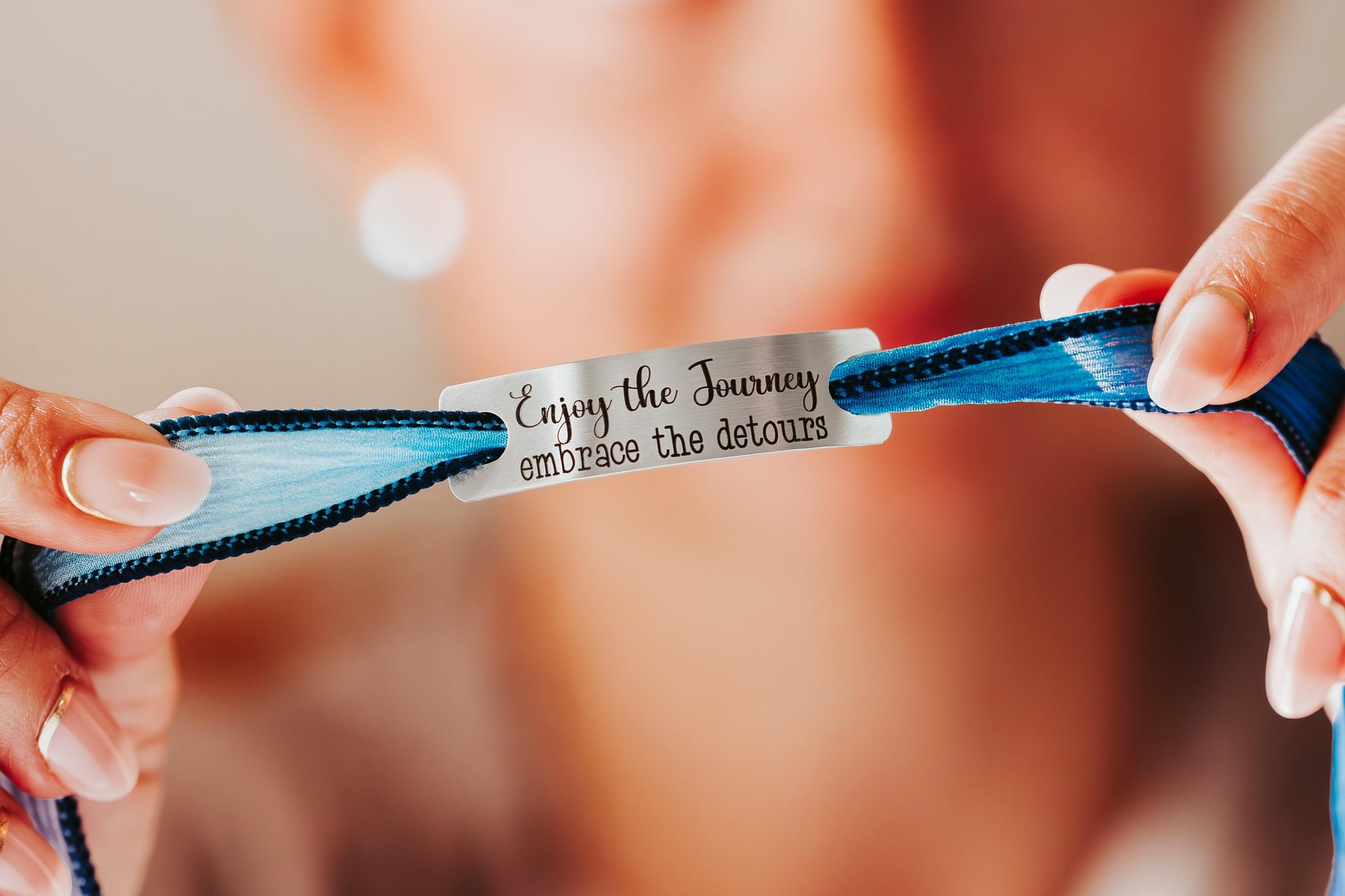 Silk wrap bracelet with stainless steel bar with what you want engraved.