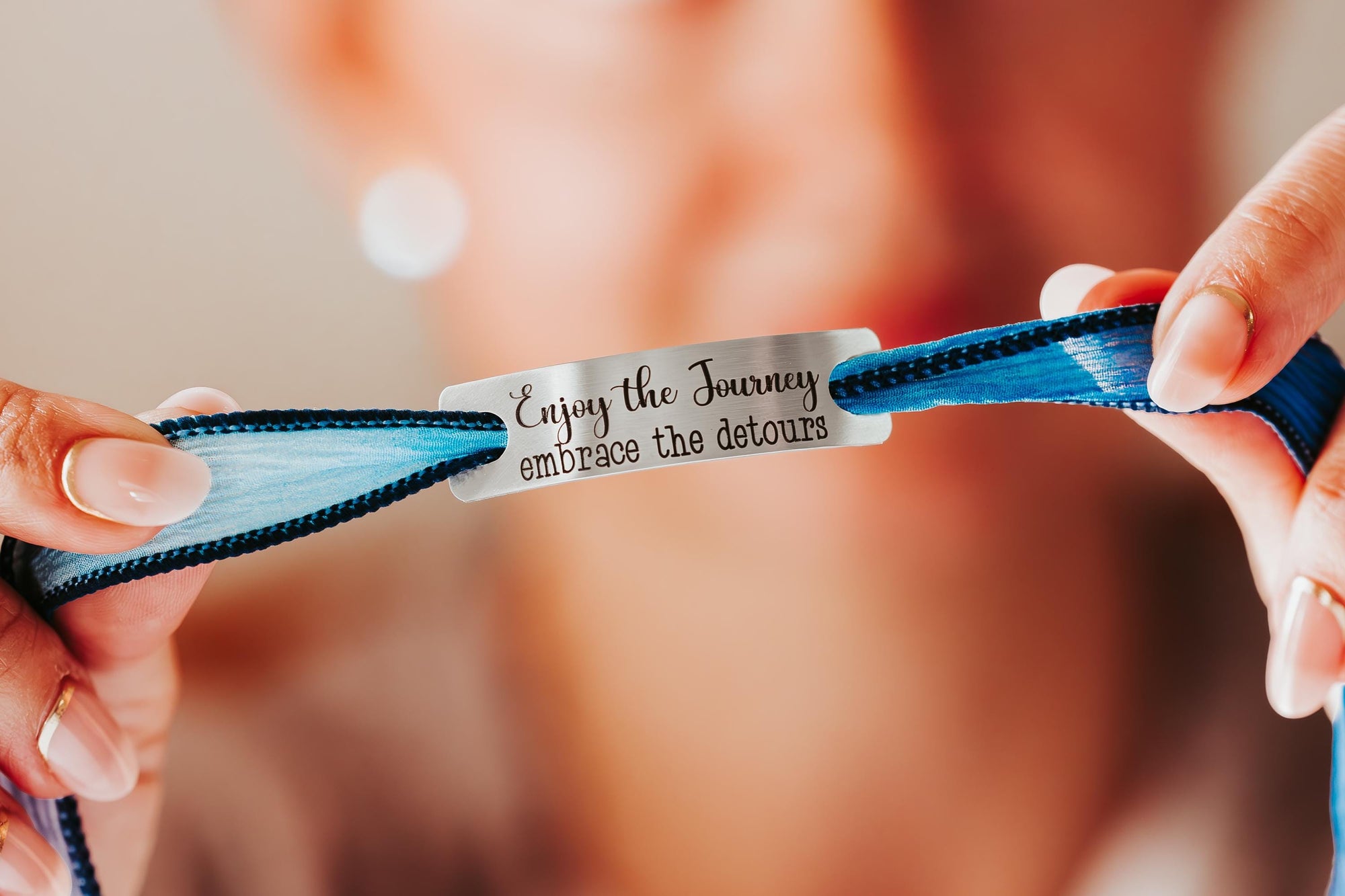 Silk wrap bracelet with stainless steel bar with what you want engraved.