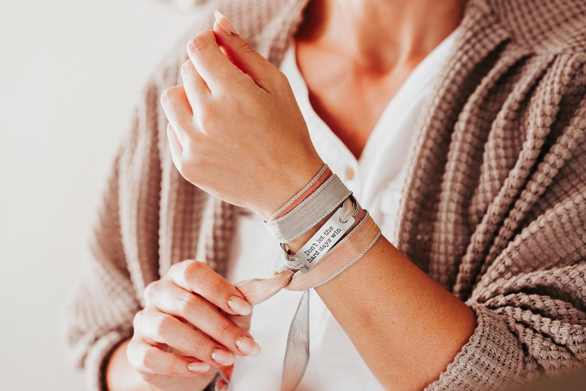 Silk wrap bracelet with stainless steel bar with what you want engraved.